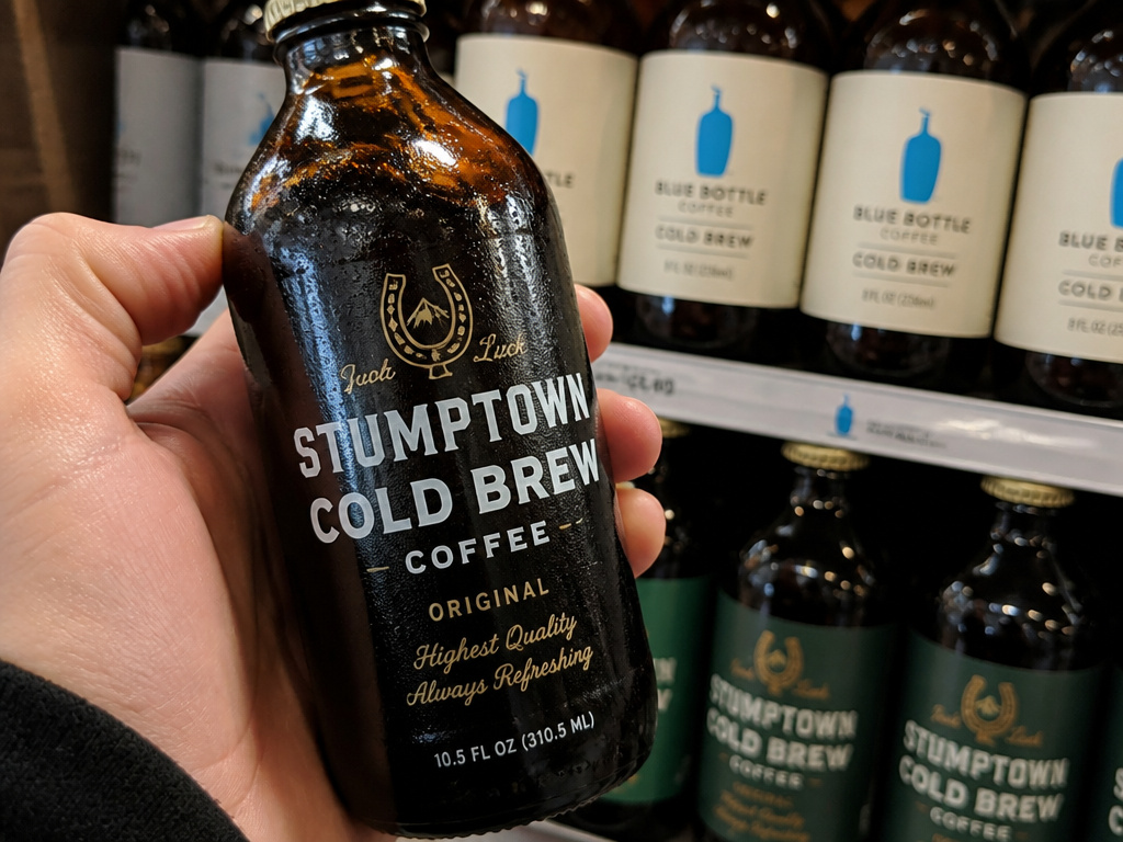 Bottled cold brew coffee on a grocery shelf, symbolizing its rise in popularity.
